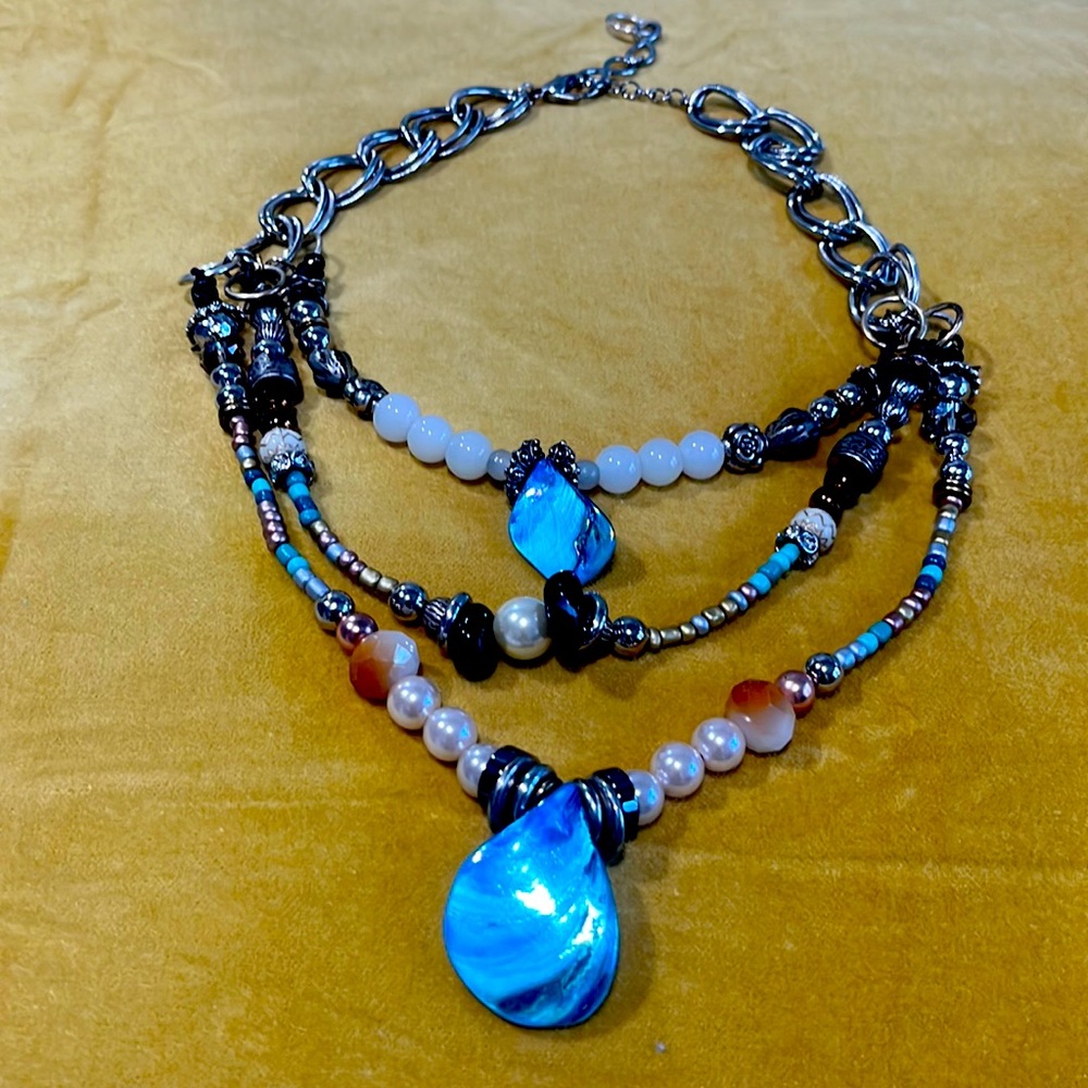 Handmade, three strand Necklace. Dyed mother of pearl shell pendants.